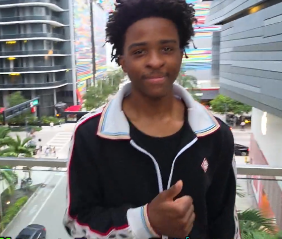 Nitro Camden giving a thumbs-up toward the camera during an outdoor IRL stream.